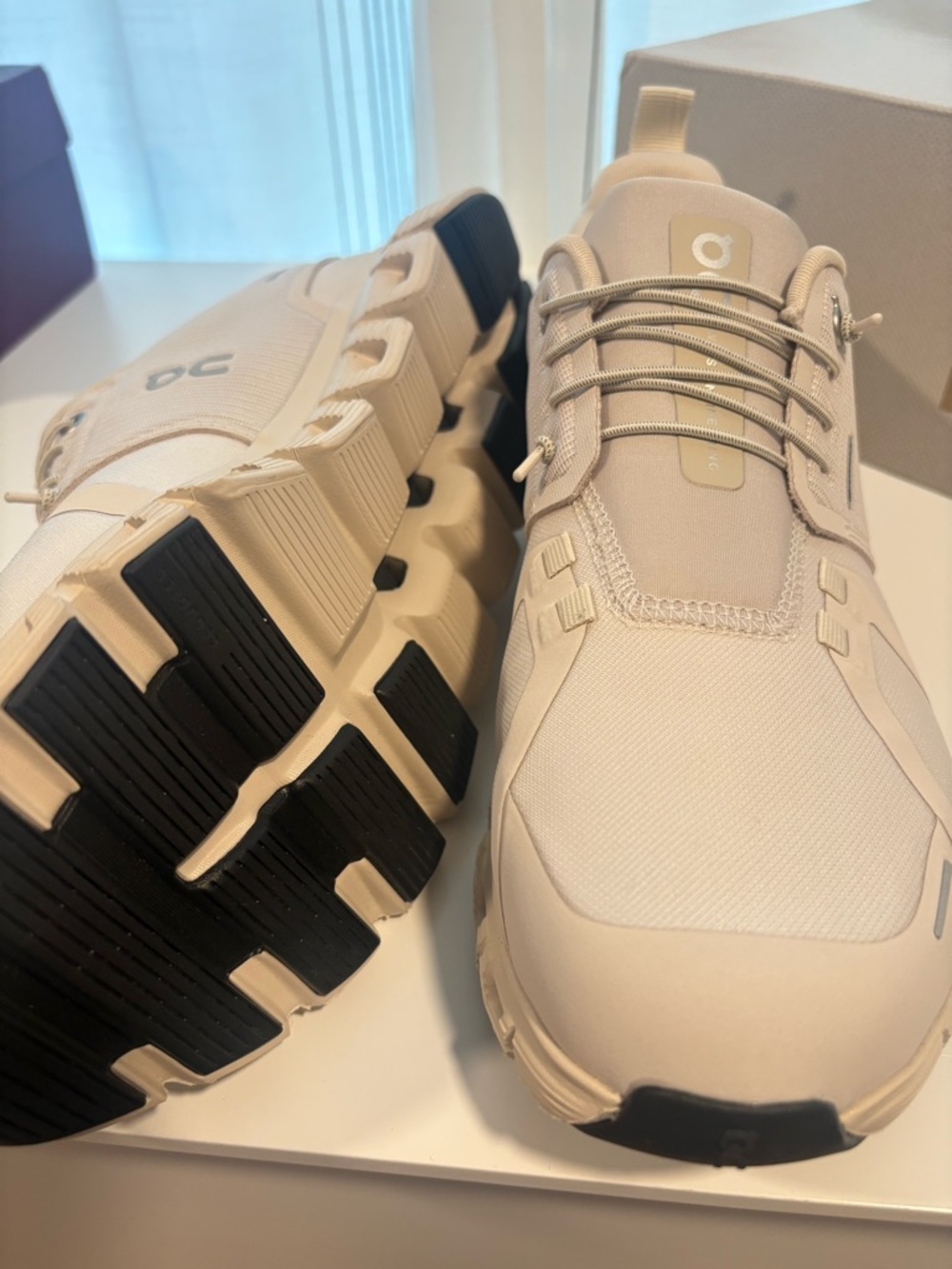 On Running Beige and Black Women’s Sneakers